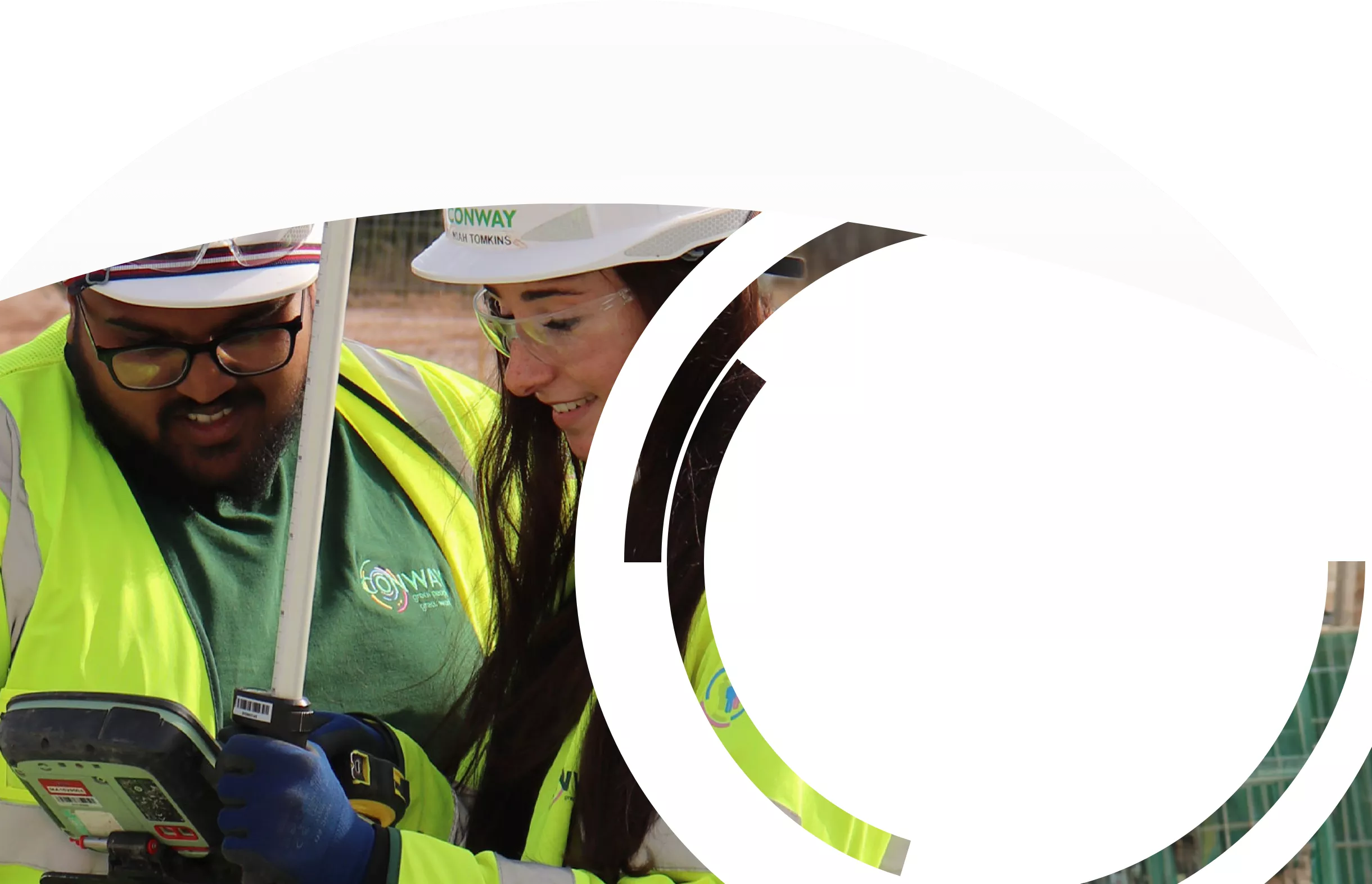 Close-up of two FM Conway workers conducting a survey